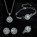 Silver jewelry set with round pendant necklace, curb bracelet, and matching stud earrings