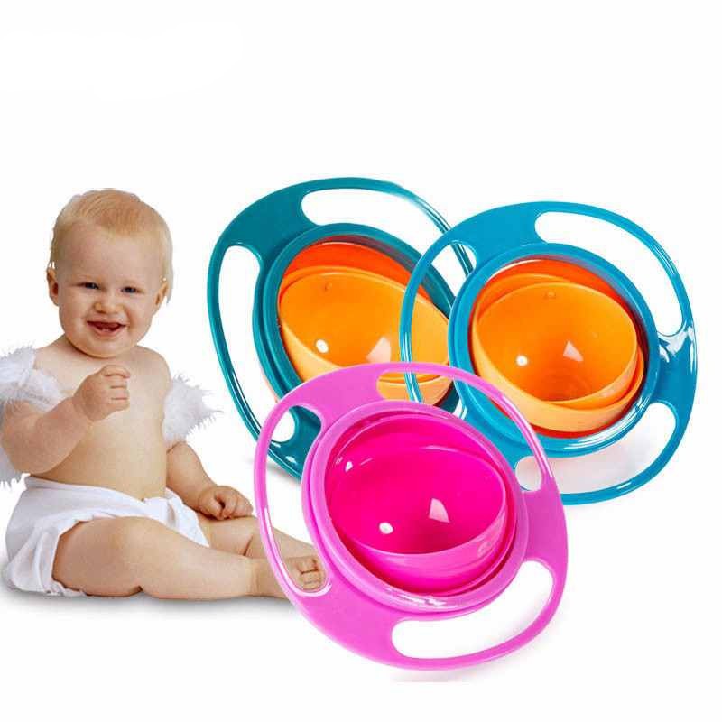 Rotating spill-proof bowl set: teal outer rings and pink outer ring with orange bowls