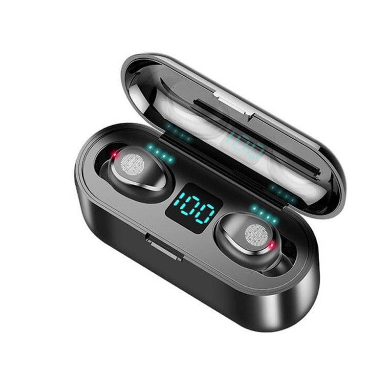 Black wireless earbuds charging in open case, blue LED bar with illuminated digits
