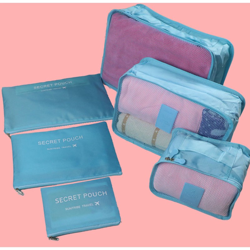 Packing cube set in light blue with mesh pouches and zippered compartments