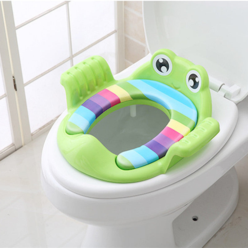 Green toddler toilet seat with animal face and beige cushioned inner pad