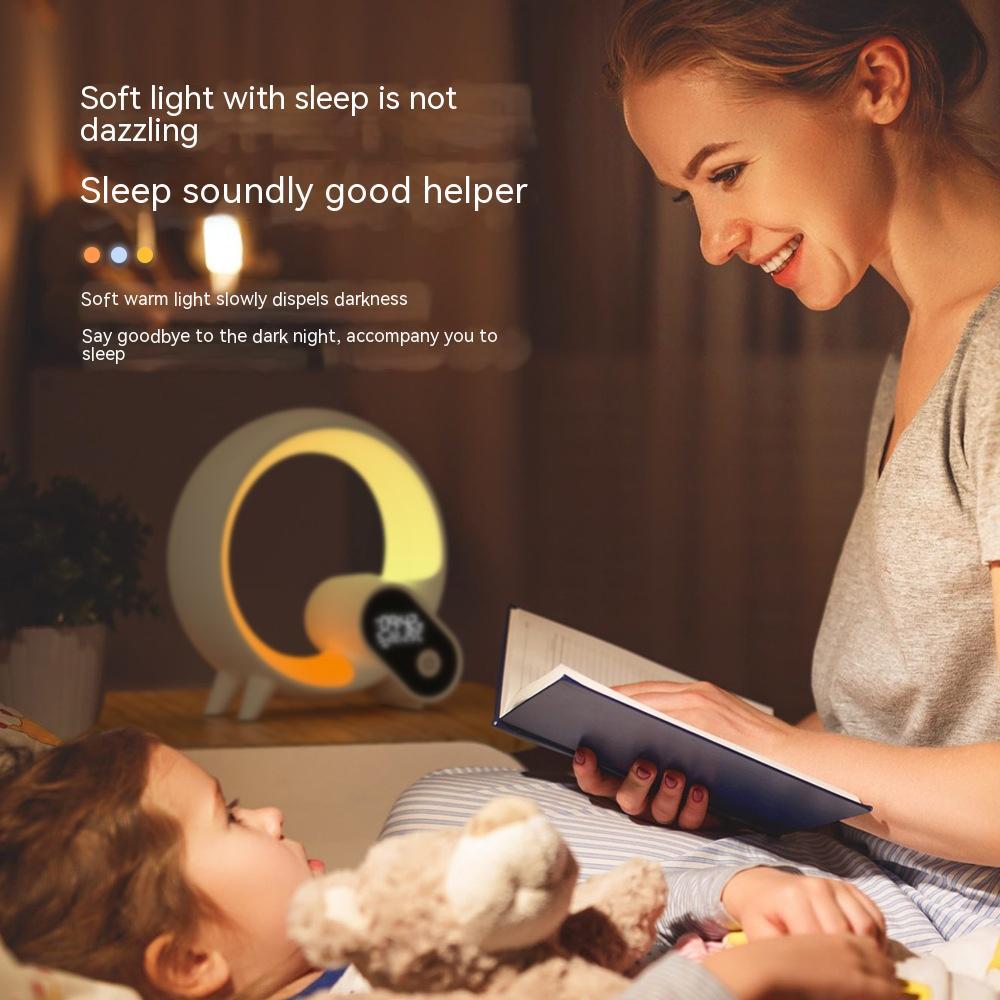 Sunrise alarm clock glowing with soft halo light and digital display on nightstand