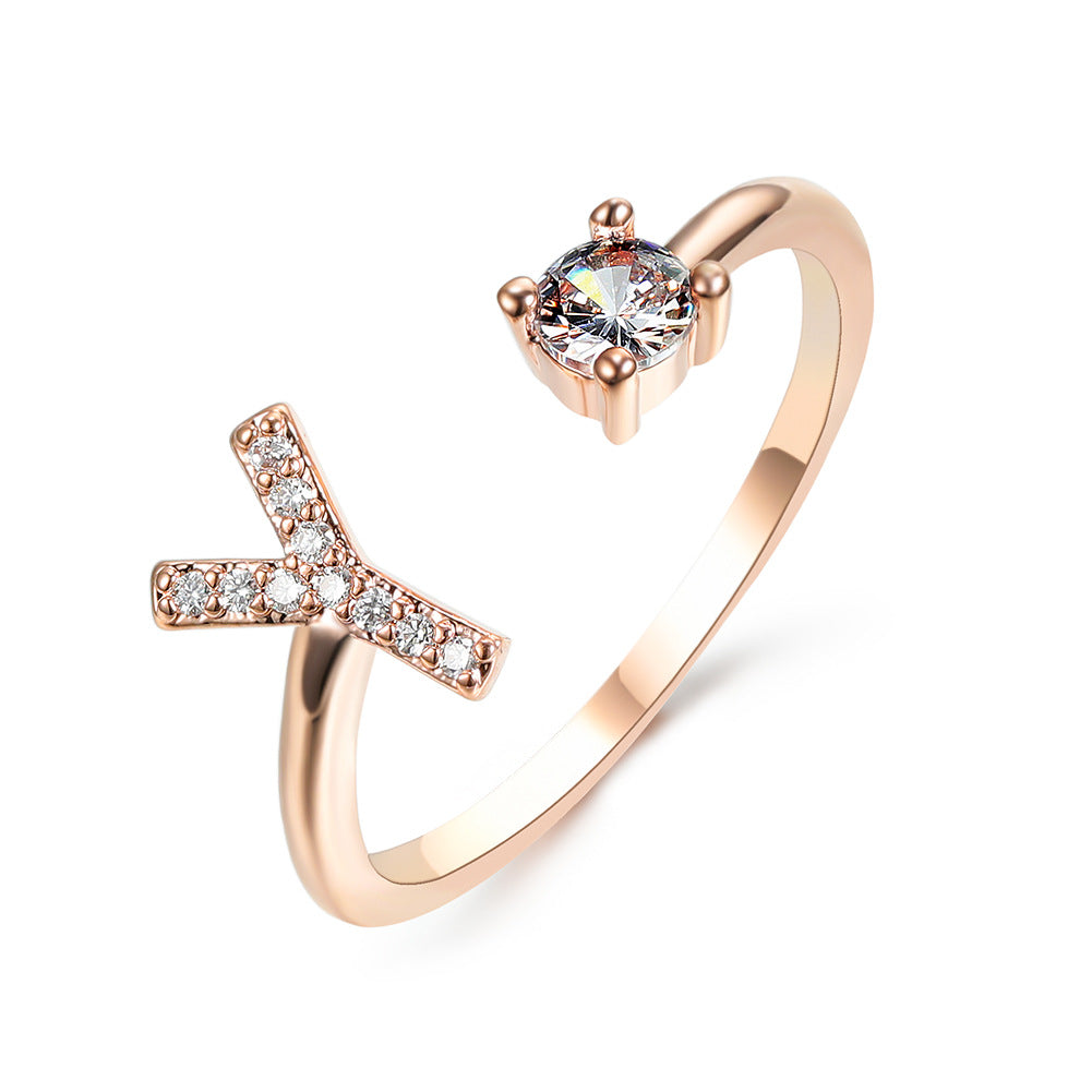 Rose gold adjustable initial ring with Y-shaped letter and round center stone.