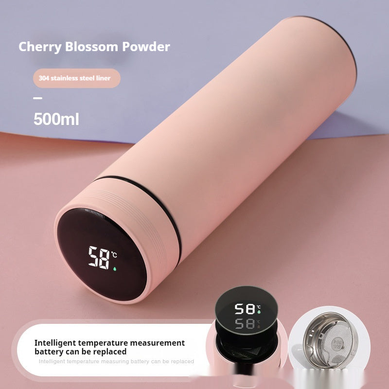 Light pink insulated bottle with smart temperature display on the black end cap