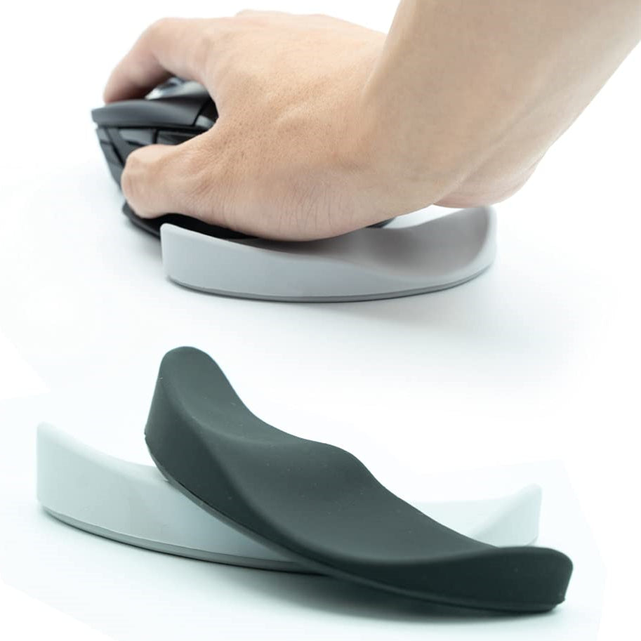 Ergonomic mouse wrist rest with black curved cushion and smooth underside
