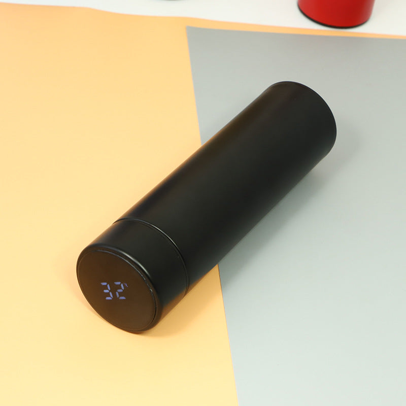 Black insulated stainless steel bottle with glowing temperature digits on base