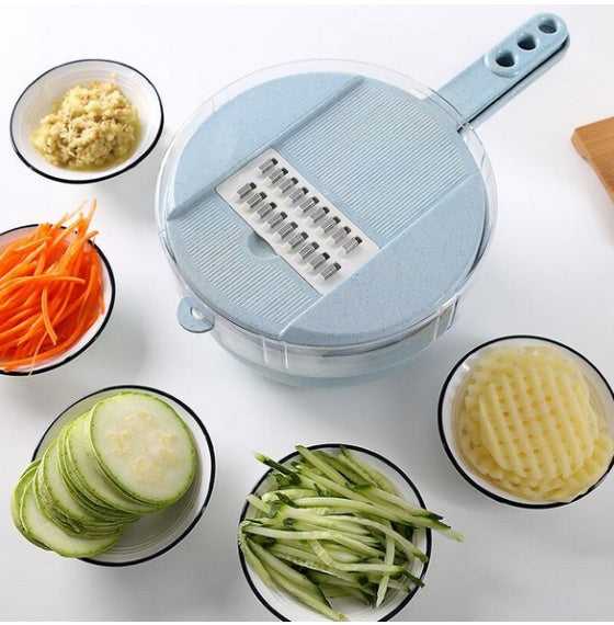 Mandoline vegetable slicer with grating plate and handle, with round base and lid.