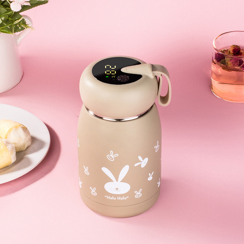 Cream insulated thermos bottle with digital temperature display and bunny graphic