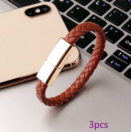 Brown braided charging cable bracelet with rose-gold metal clasp and USB connector