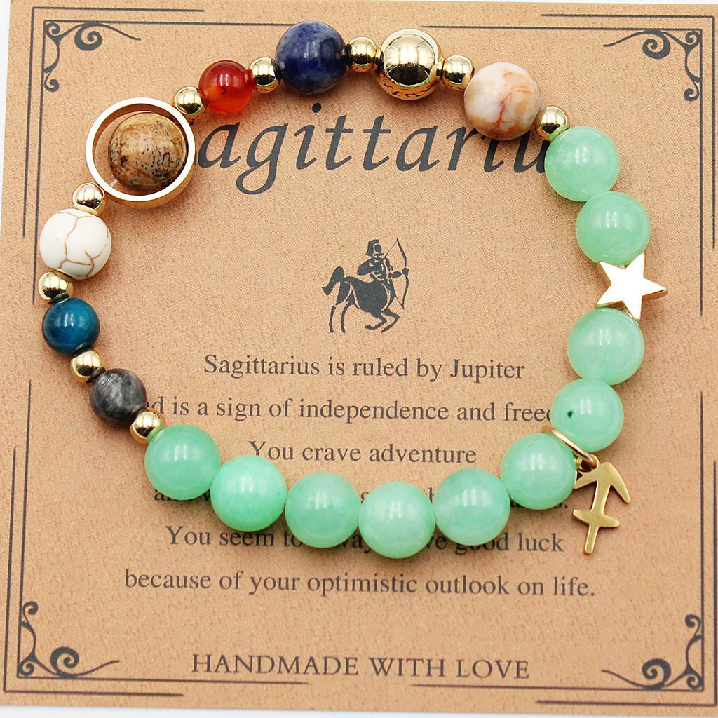 Beaded zodiac bracelet with mint green beads, gold spacers, star charm and arrow-shaped charm