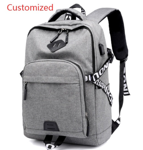 Gray USB laptop backpack with top handle, front zipper compartment, and webbing strap