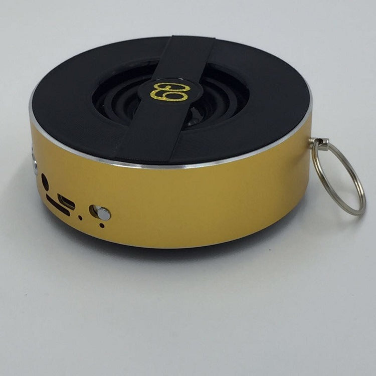 Outdoor Bluetooth speaker, gold with black top and key ring