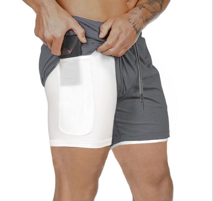 Dark gray pocket compression shorts with front pouch and drawstring, stretch fit