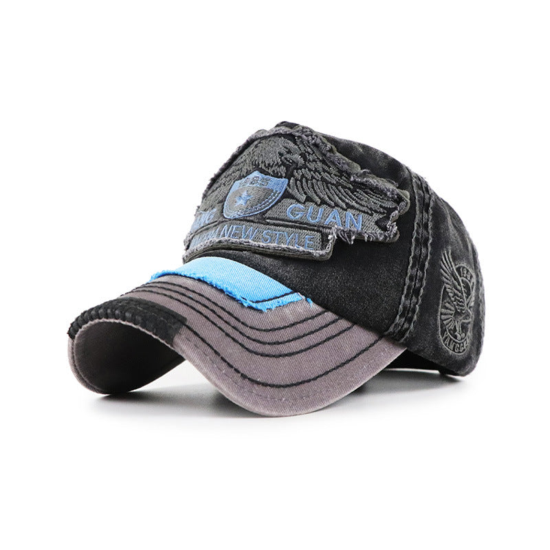 Baseball cap, black with light blue accent band; GUAN patch and side leaf emblem
