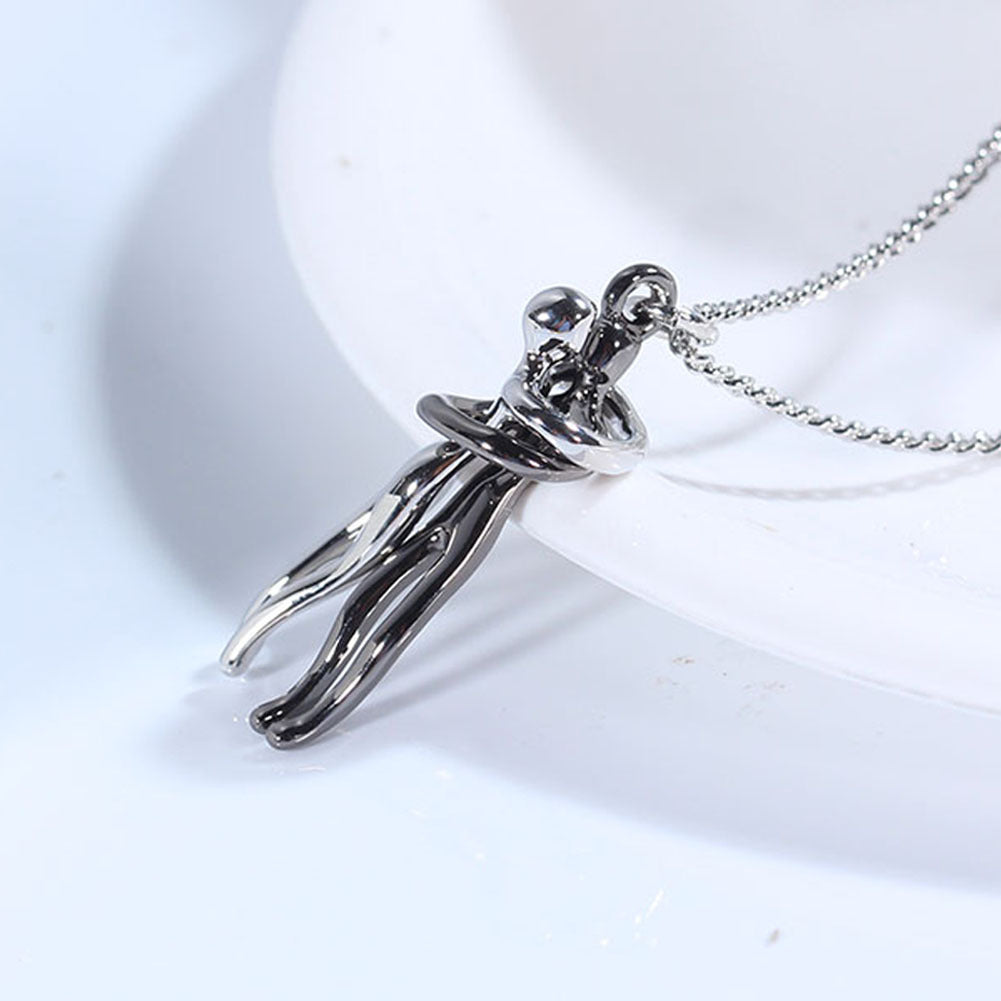 Love hug necklace with silver chain and dark two-tone hugging couple pendant