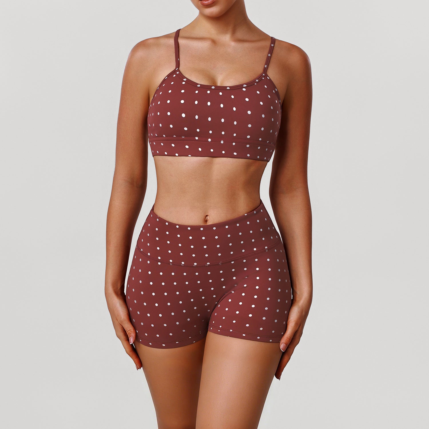 Women’s rust red sports bra and shorts set with white dot print, scoop neckline