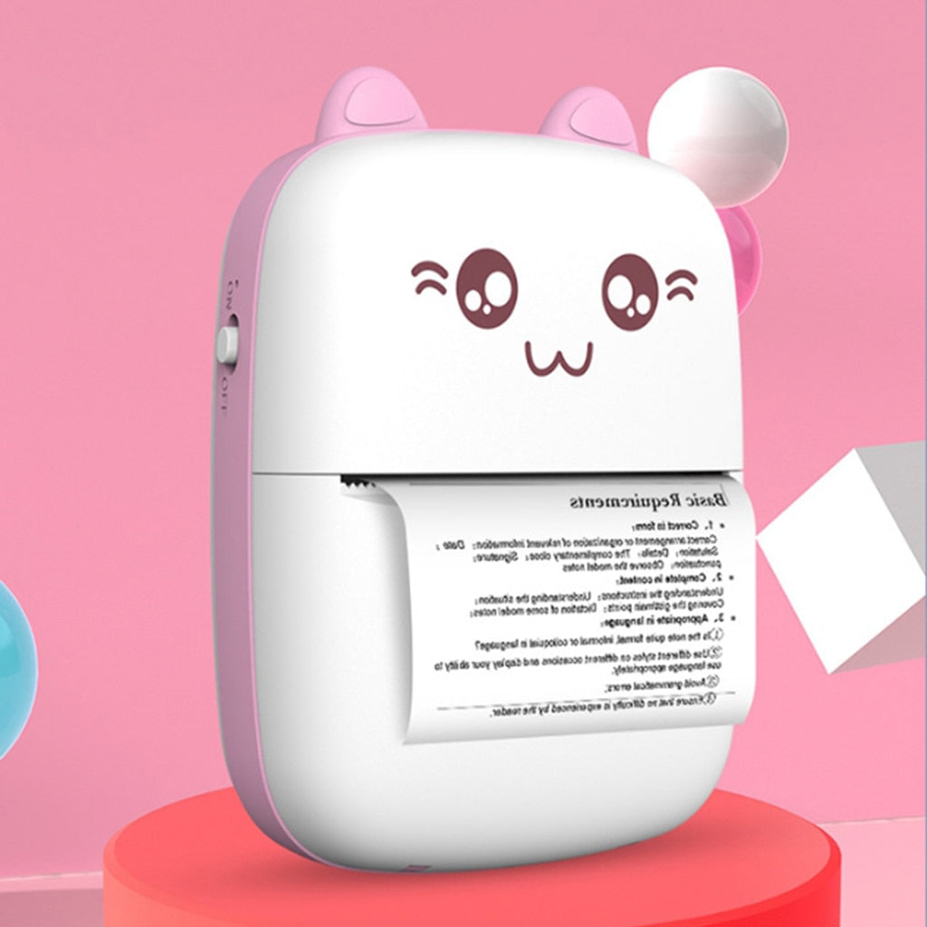 Mini label printer with cat face, pink body, white paper roll printing