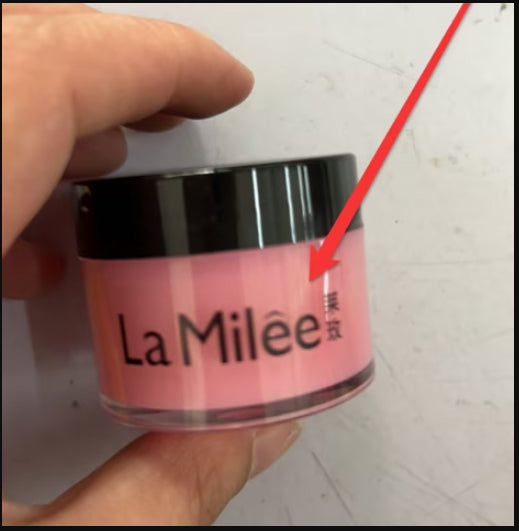 La Milée lip mask jar with pink label held by hand