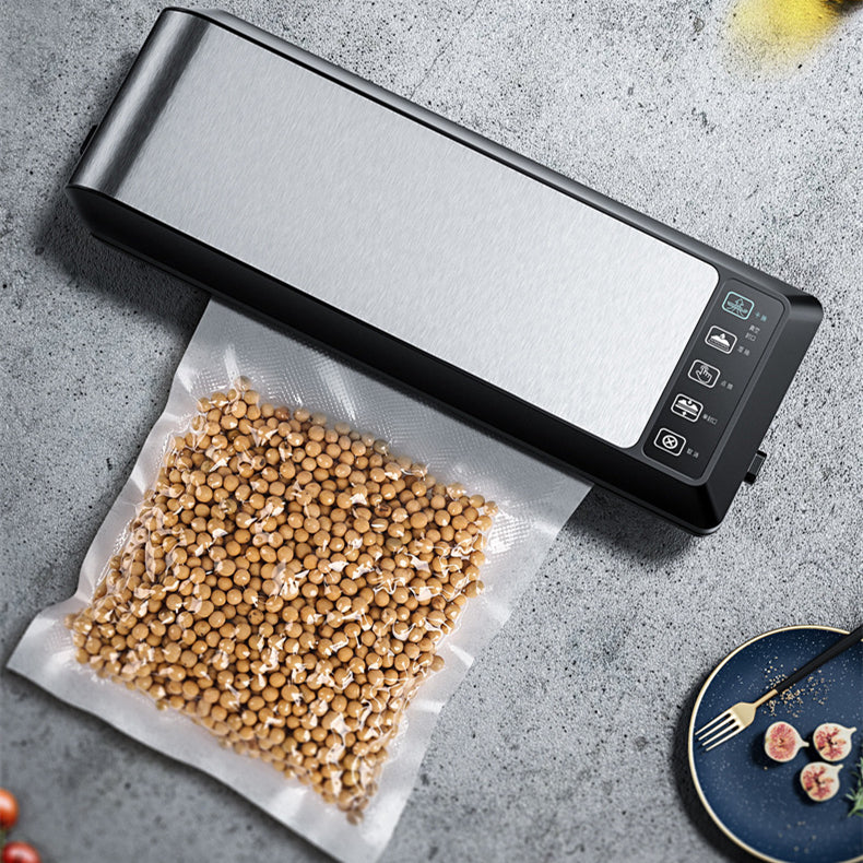 Black vacuum sealer on countertop with bag of grains being sealed