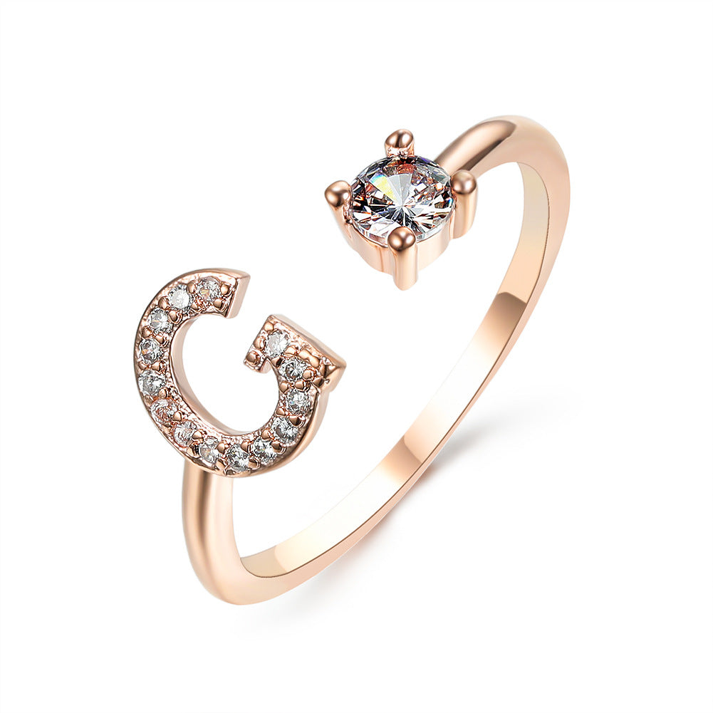 Rose gold initial letter ring with pavé rhinestones and round center crystal
