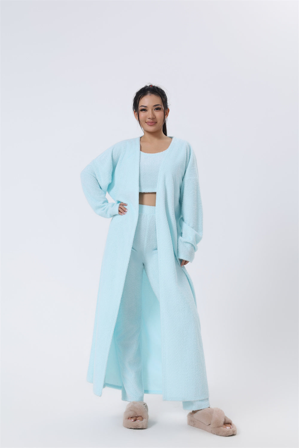 Women’s 3-piece pajama set in light blue: crop top, pants, and long open cardigan robe.