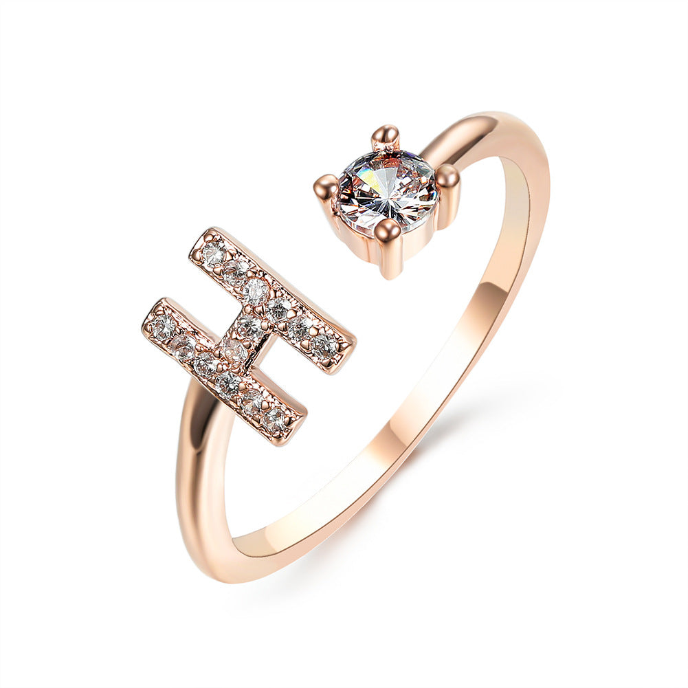 Rose gold initial letter ring with pavé rhinestones and round center crystal