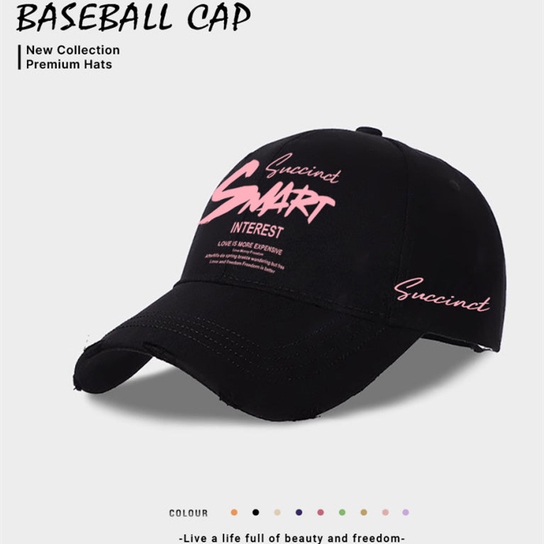 Black baseball cap with front embroidered graphic and pink “Succinct” text