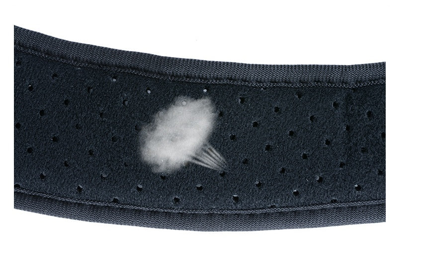Close-up of black elastic back strap with dotted texture and fastening cushion