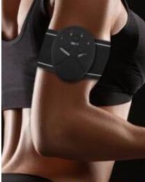 EMS abs muscle trainer electrode pad worn on an arm with handheld controller