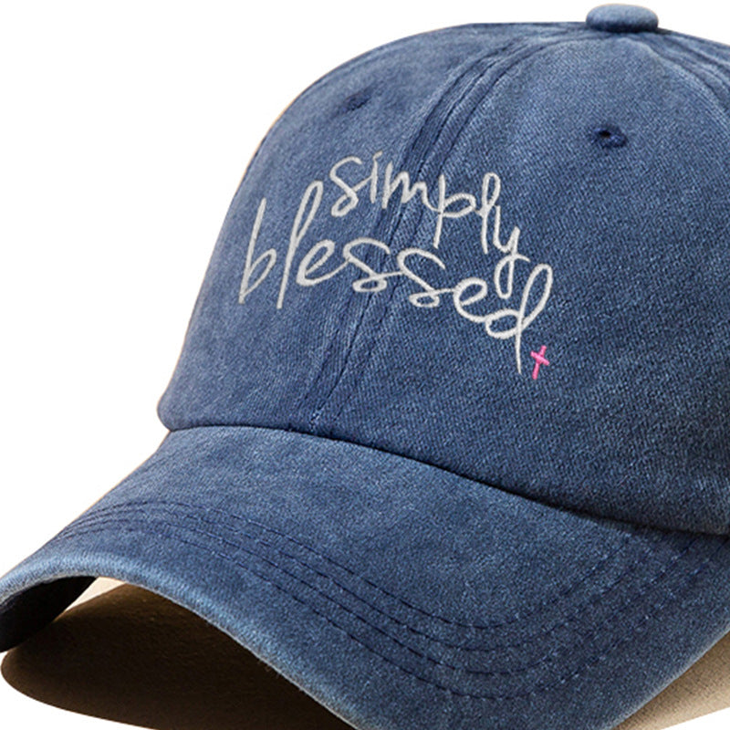 Denim blue baseball cap with embroidered "Simply Blessed" script on front panel