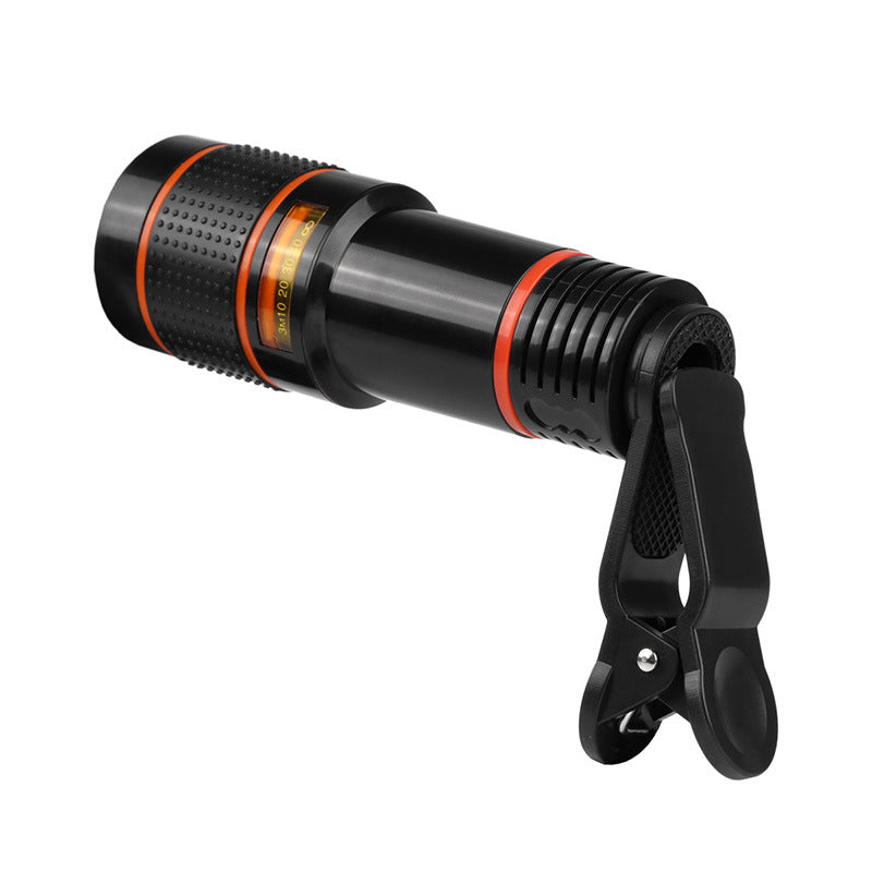 Black telescope-style camera lens with orange trim and textured focus ring