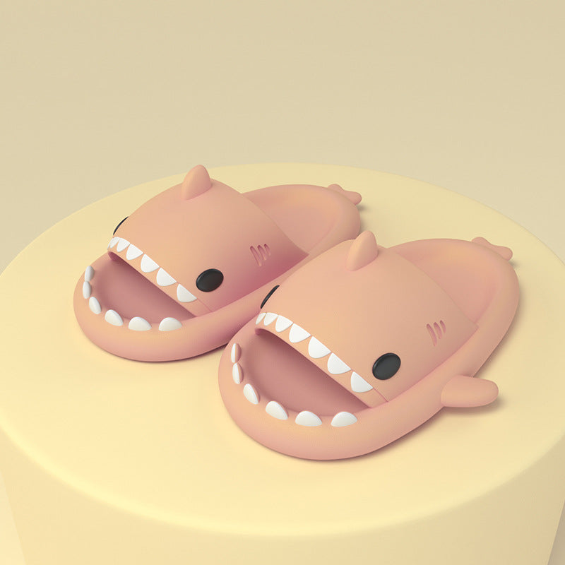 Cartoon shark slippers pair in beige/pink, soft slides with smiling teeth