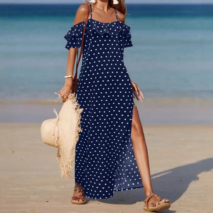 Off-shoulder long polka dot dress in navy with ruffled sleeves and side slit