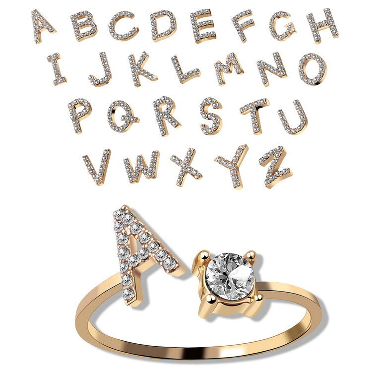 Gold tone initial A ring with round crystal center and pave letter detailing