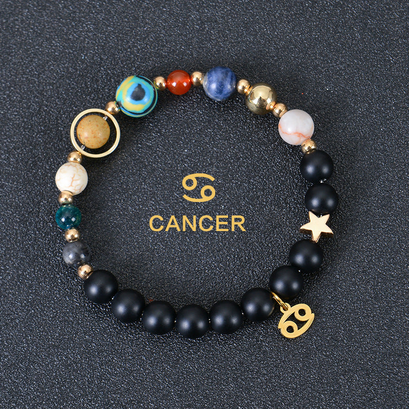Cancer zodiac beaded bracelet with black matte beads, colorful stone beads, and gold star charm