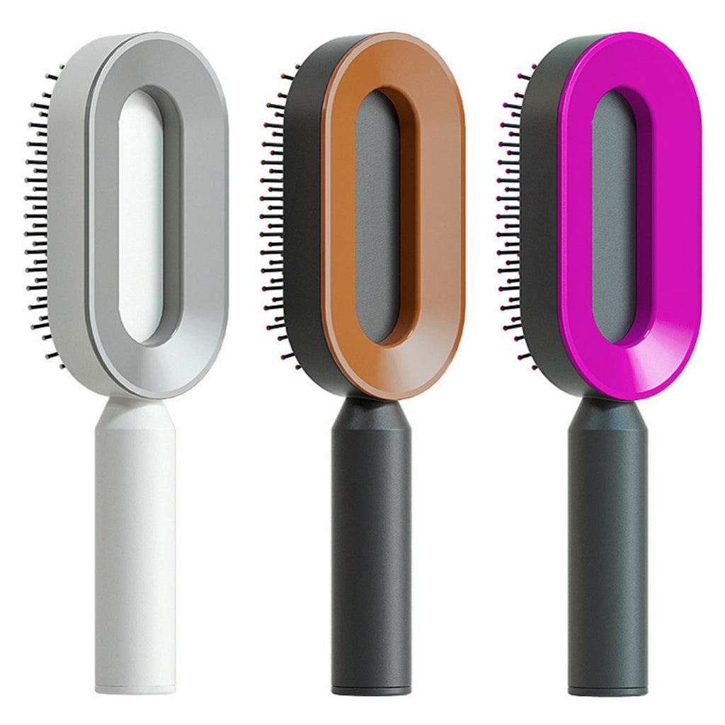 Self-cleaning hair brush set with oval light gray, tan, and purple cleaning heads and white/dark handles