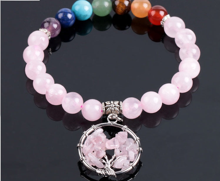 Pink crystal beaded bracelet with multicolor bead row and round pink wire pendant centerpiece