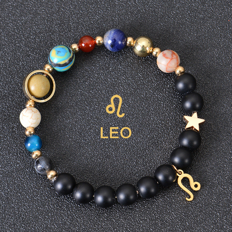 Leo zodiac beaded bracelet with black matte beads, colorful stone beads, and gold zodiac charm