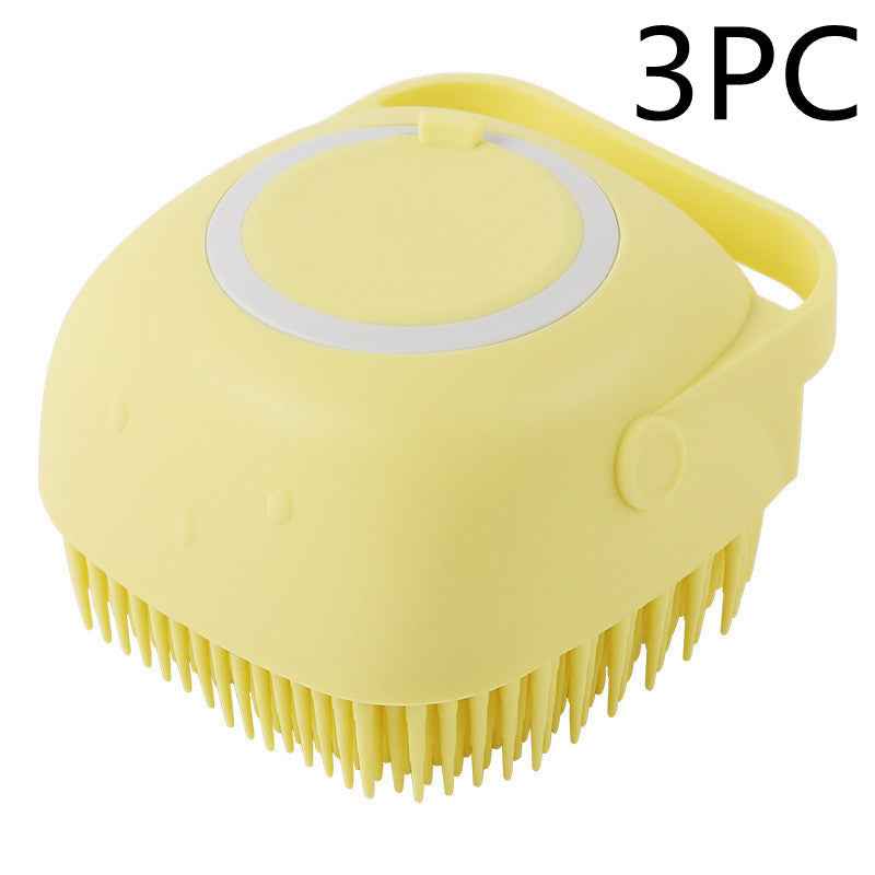 Yellow silicone pet grooming brush with oval massage pad and side carry handle