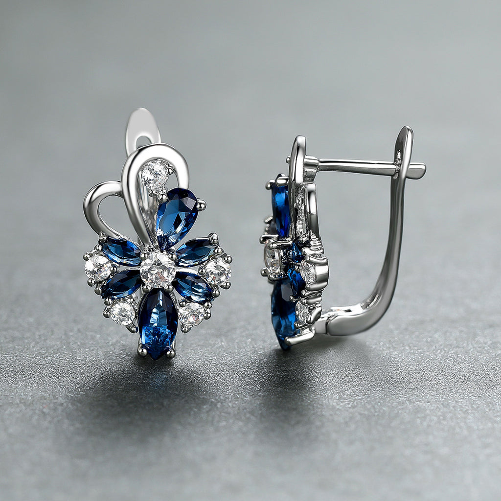Silver-tone drop earrings with blue marquise and pear stones, clear flower accents