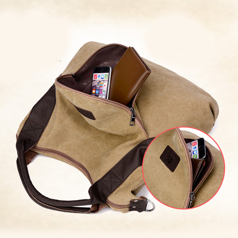 Khaki canvas shoulder bag with top zipper opening and phone visible in front pocket