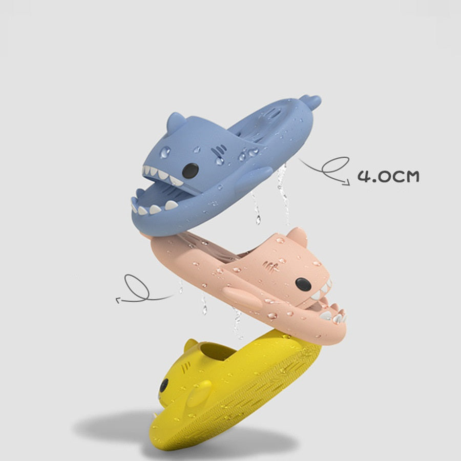 Color set of shark-shaped EVA shower slides with drainage holes, water-splash shown