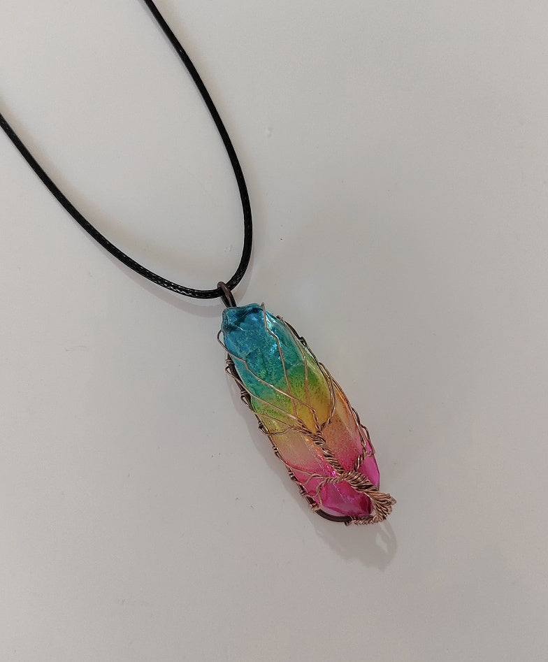 Rainbow crystal pillar pendant on a black cord necklace