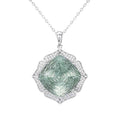 Green crystal pendant necklace with silver-toned halo and faceted teardrop center stone