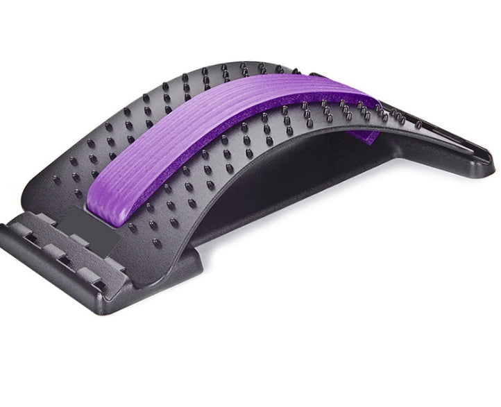 Lumbar traction therapy back brace with purple ribbed pad and black dotted base