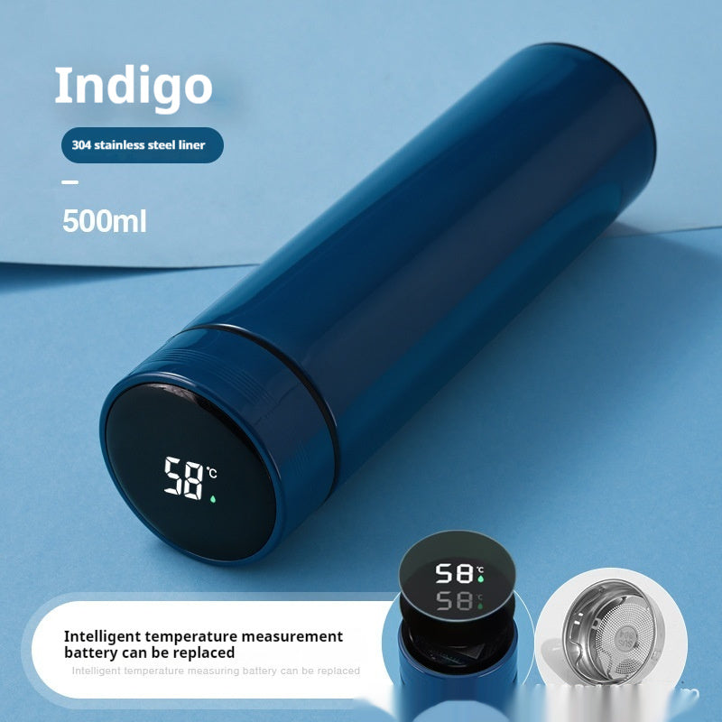 Smart temperature display insulated bottle, indigo blue, round display showing 58°C