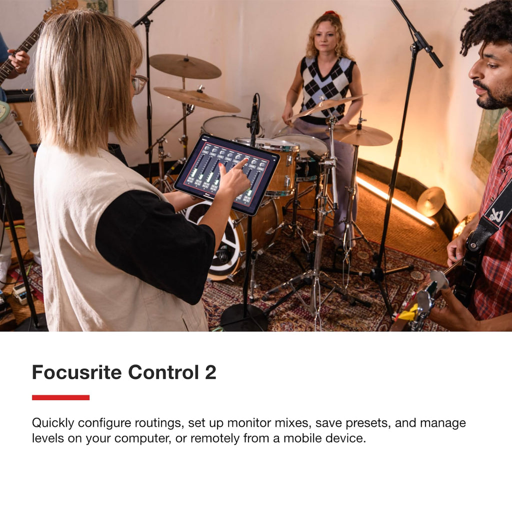 Red Focusrite Scarlett 18i16 USB audio interface on studio desk with tablet control