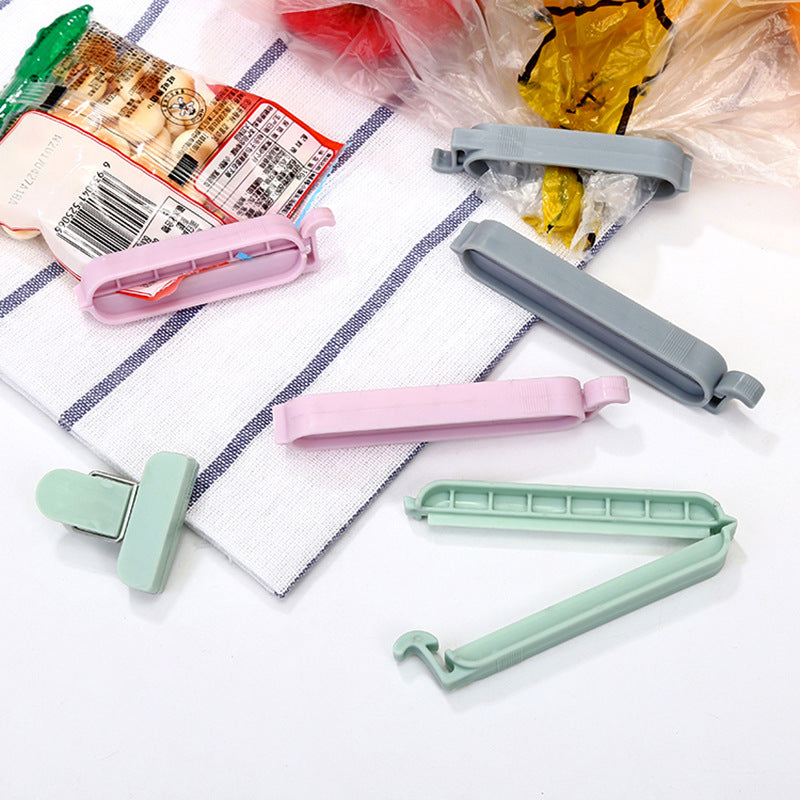 Plastic snack bag sealing clips with clasps, pastel pink, mint, and gray