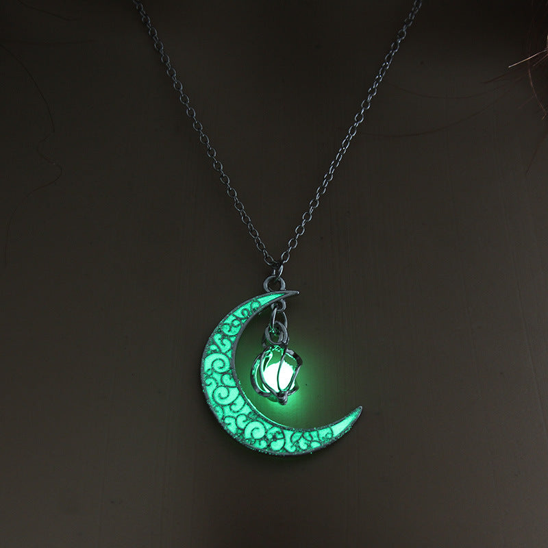 Glowing green moon pendant with cat lantern charm on silver chain necklace