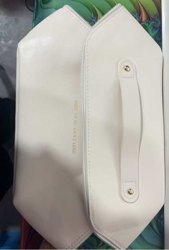 Large travel cosmetic bag in white with front handle strap and zipper closure